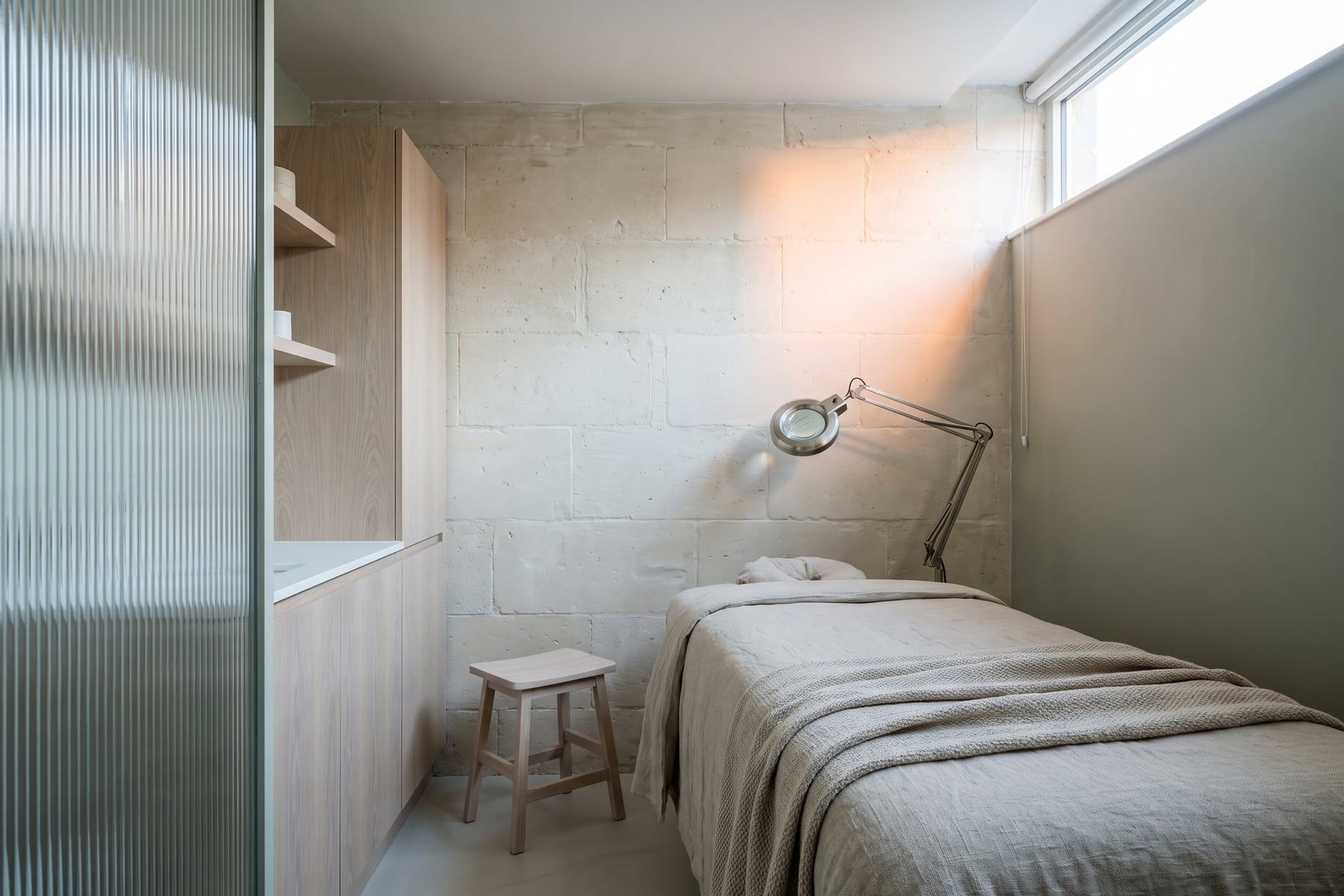Morning: the same treatment room in cool morning daylight and warm evening lamplight